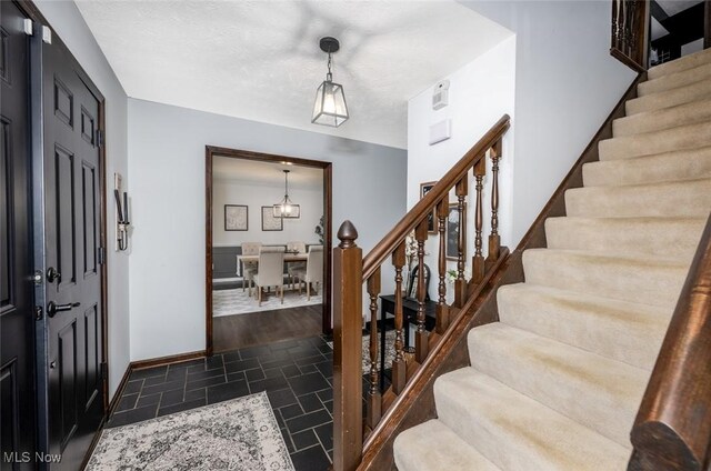 1593 Stonington Dr, Hudson, OH 44236 - entrance foyer with stone finish flooring and stairway