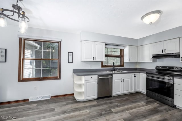 1593 Stonington Dr, Hudson, OH 44236 - kitchen with stainless steel appliances, under cabinet range hood, dark countertops, and white cabinets