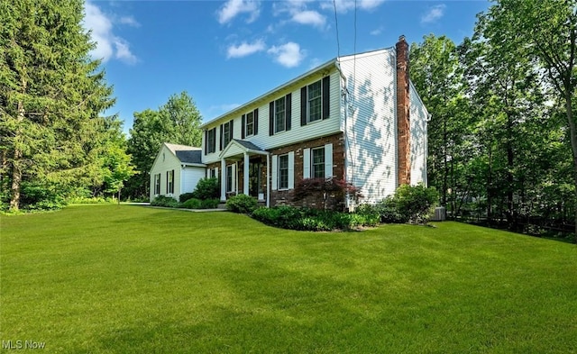 1593 Stonington Dr, Hudson, OH 44236 - colonial inspired home with a chimney, a front lawn, and brick siding