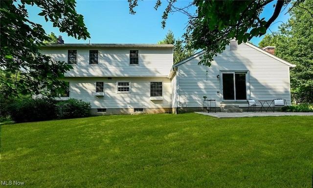 1593 Stonington Dr, Hudson, OH 44236 - back of house featuring a yard, a chimney, and a patio area
