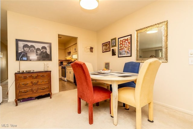 2112 Acacia Park Dr Unit 220, Lyndhurst, OH 44124 - dining space with light carpet and baseboards