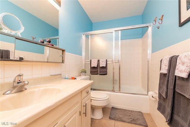 2112 Acacia Park Dr Unit 220, Lyndhurst, OH 44124 - full bathroom with tile walls, vanity, shower / bath combination with glass door, tile patterned flooring, and a wainscoted wall
