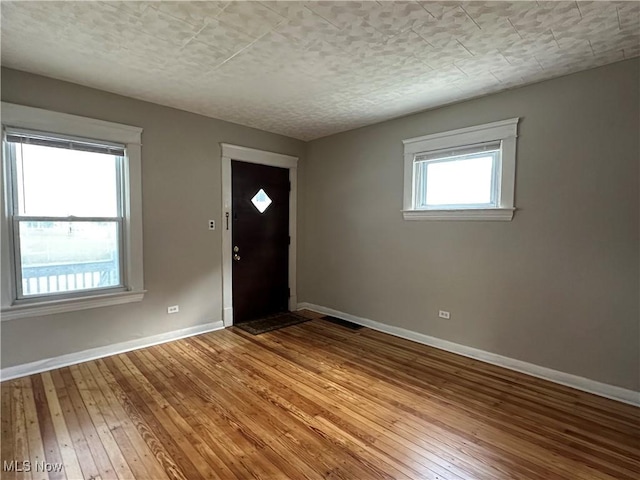 4011 E 29th St, Newburgh Heights, OH 44105 - entryway featuring wood-type flooring