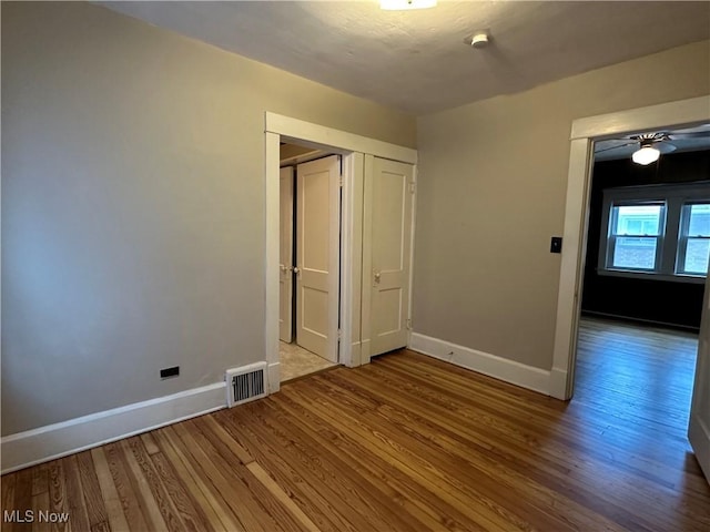 4011 E 29th St, Newburgh Heights, OH 44105 - unfurnished bedroom with wood finished floors and a closet