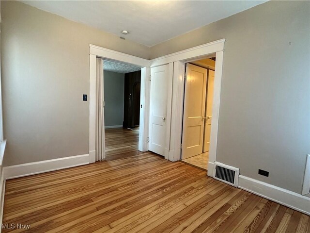 4011 E 29th St, Newburgh Heights, OH 44105 - empty room featuring light wood-style floors