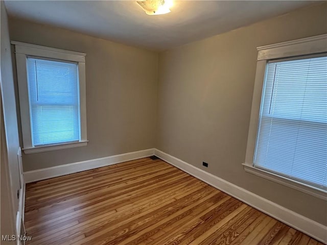 4011 E 29th St, Newburgh Heights, OH 44105 - spare room with baseboards and wood finished floors