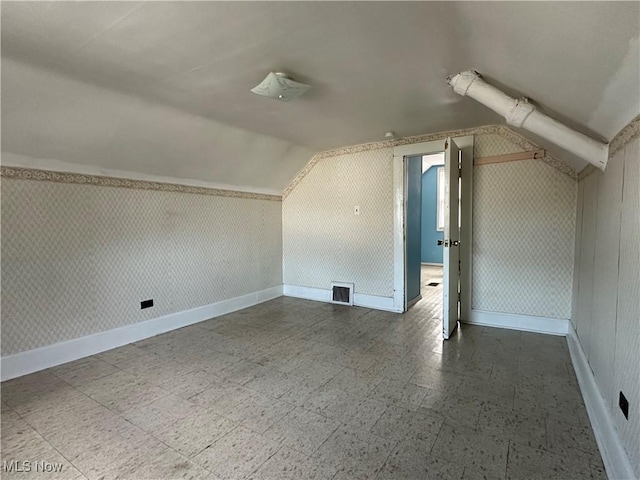 4011 E 29th St, Newburgh Heights, OH 44105 - bonus room featuring tile patterned floors and lofted ceiling