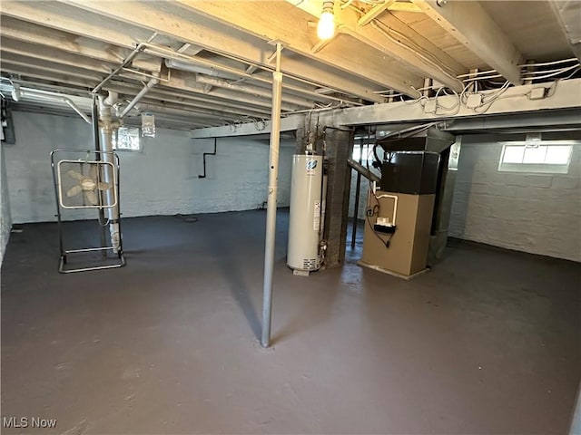 4011 E 29th St, Newburgh Heights, OH 44105 - below grade area featuring gas water heater, heating unit, and healthy amount of natural light