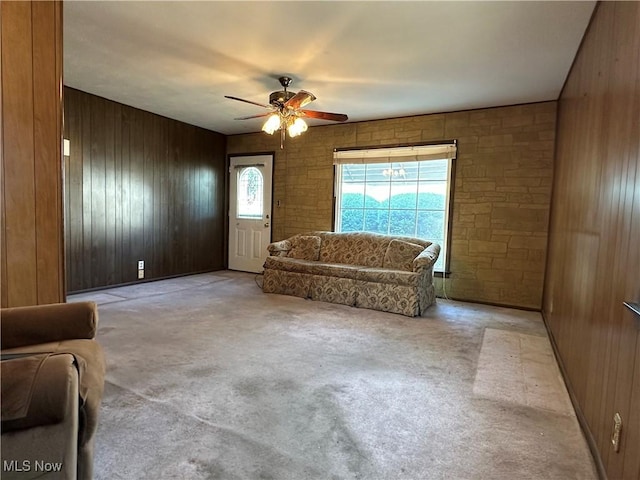 4013 E 29th St, Newburgh Heights, OH 44105 - carpeted living area featuring wooden walls and ceiling fan
