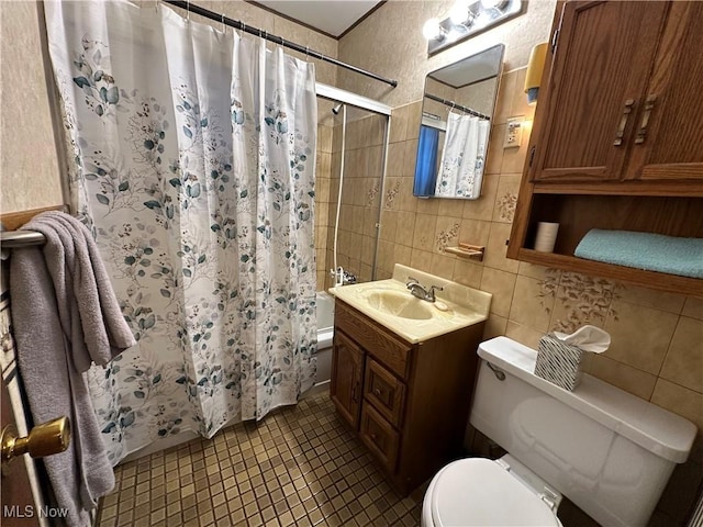 4013 E 29th St, Newburgh Heights, OH 44105 - full bath with vanity, tile walls, tile patterned floors, and shower / bath combination with curtain