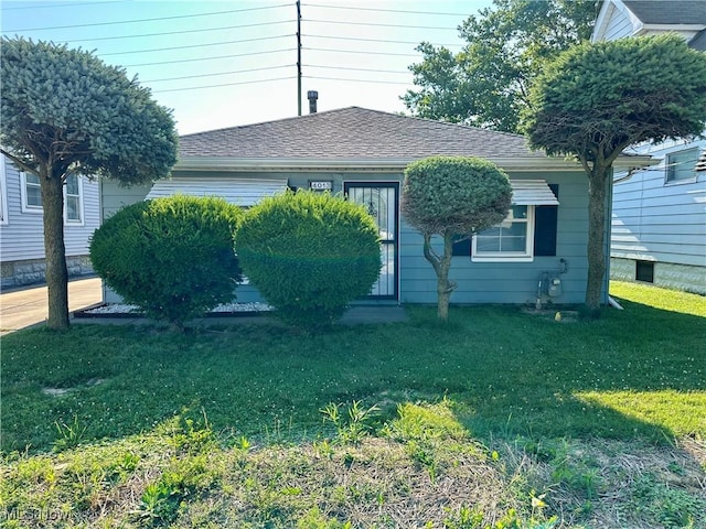 4013 E 29th St, Newburgh Heights, OH 44105 - bungalow with a front lawn and entry steps