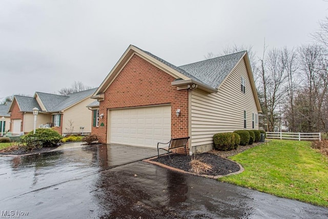 8121 Hitchcock Rd Unit 11, Boardman, OH 44512 - view of side of property with an attached garage, driveway, brick siding, and a shingled roof
