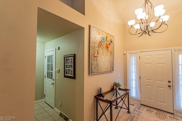 8121 Hitchcock Rd Unit 11, Boardman, OH 44512 - foyer entrance featuring light tile patterned floors, a chandelier, and high vaulted ceiling