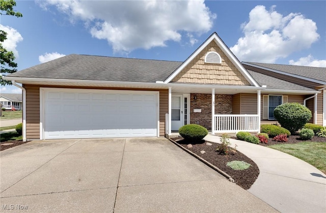 189 Park Place Dr, Wadsworth, OH 44281 - view of front of house featuring covered porch, concrete driveway, a garage, brick siding, and a shingled roof