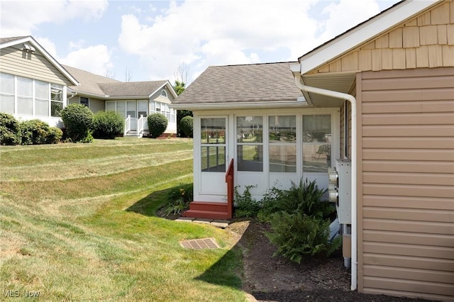 189 Park Place Dr, Wadsworth, OH 44281 - view of grassy yard with a sunroom