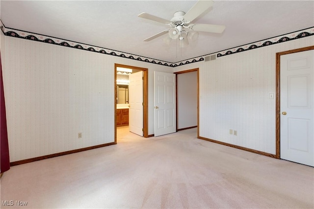 189 Park Place Dr, Wadsworth, OH 44281 - unfurnished bedroom with light carpet, a ceiling fan, and connected bathroom