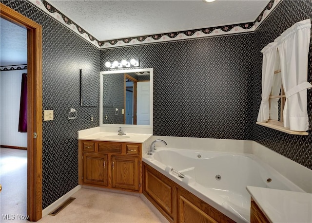 189 Park Place Dr, Wadsworth, OH 44281 - full bath with wallpapered walls, a tub with jets, vanity, and a textured ceiling