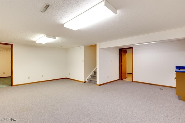 189 Park Place Dr, Wadsworth, OH 44281 - finished basement with stairs, light carpet, and a textured ceiling