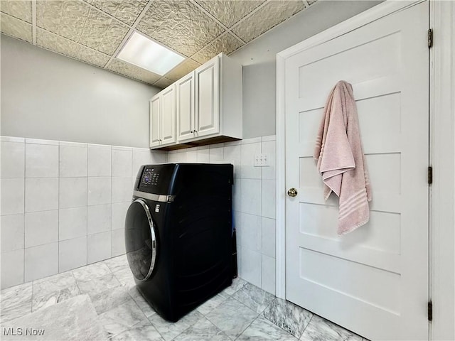 5519 4th Ave, Vienna, WV 26105 - laundry room with washer / clothes dryer, tile walls, light marble finish flooring, and cabinet space