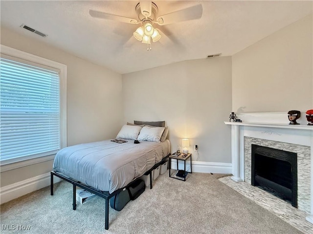 5519 4th Ave, Vienna, WV 26105 - bedroom with light carpet, a fireplace, and ceiling fan