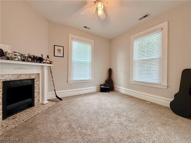 5519 4th Ave, Vienna, WV 26105 - unfurnished living room with a premium fireplace, ceiling fan, and carpet