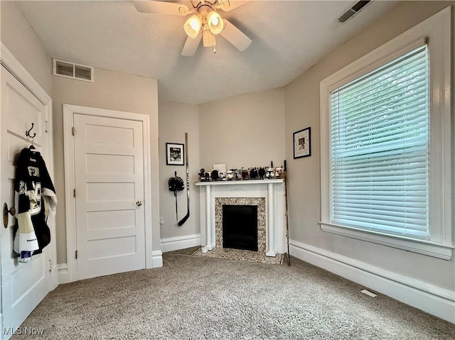 5519 4th Ave, Vienna, WV 26105 - carpeted living area with ceiling fan and a fireplace with flush hearth