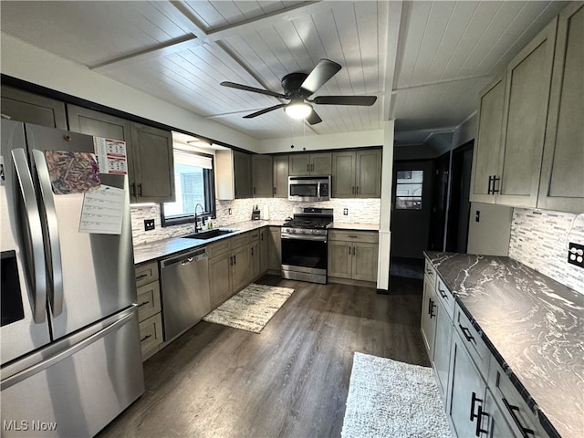 607 Wyndclift Cir, Austintown, OH 44515 - kitchen featuring appliances with stainless steel finishes, backsplash, dark wood-style flooring, ceiling fan, and wood ceiling