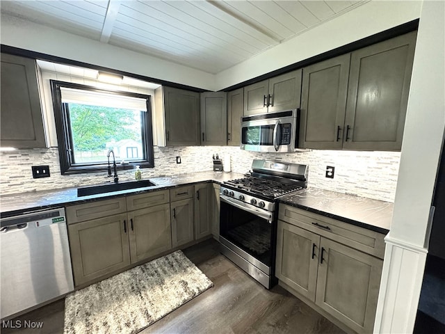 607 Wyndclift Cir, Austintown, OH 44515 - kitchen with appliances with stainless steel finishes, decorative backsplash, wood ceiling, dark wood-style flooring, and gray cabinets