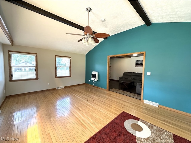 607 Wyndclift Cir, Austintown, OH 44515 - unfurnished living room featuring heating unit, light wood-style flooring, and a ceiling fan