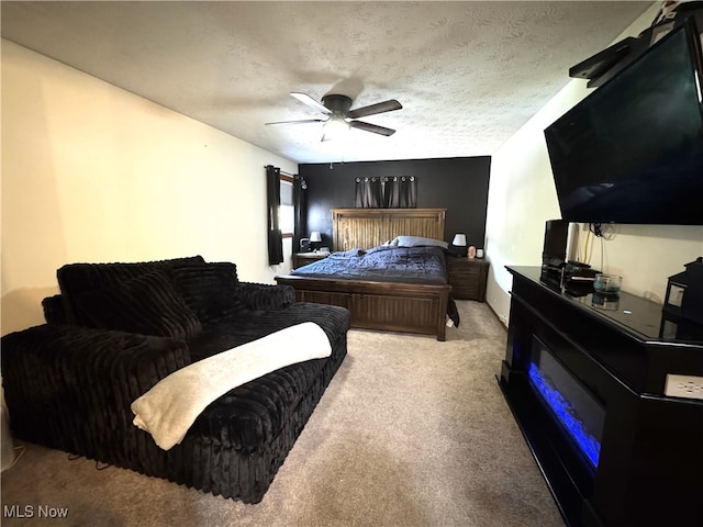 607 Wyndclift Cir, Austintown, OH 44515 - carpeted bedroom featuring a ceiling fan, a fireplace, and a textured ceiling