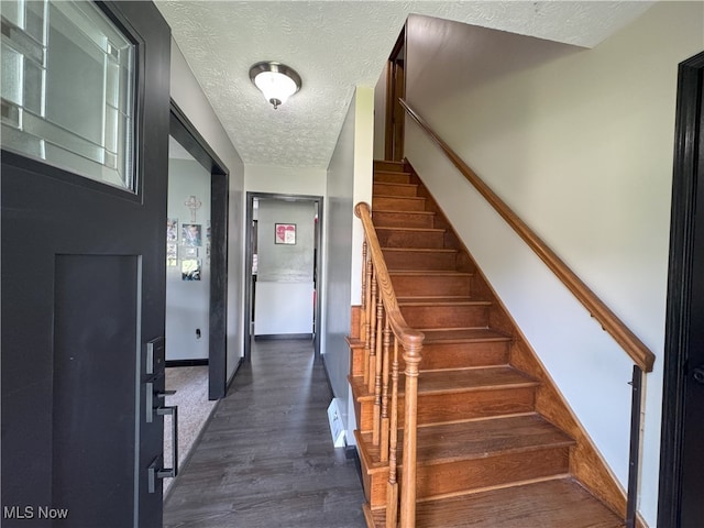 607 Wyndclift Cir, Austintown, OH 44515 - stairway with a textured ceiling and wood finished floors