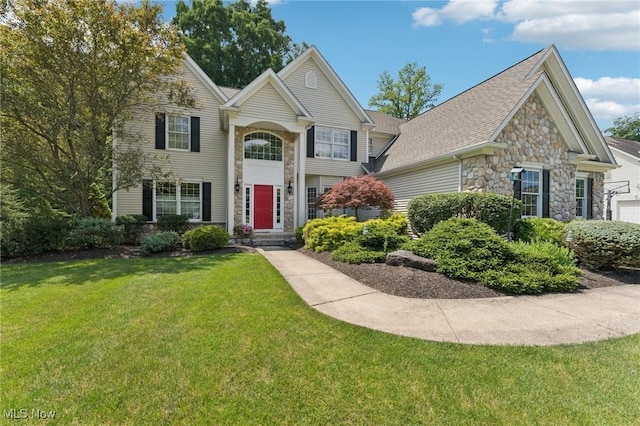 915 Cimarron Oval, Aurora, OH 44202 - traditional home featuring stone siding and a front yard