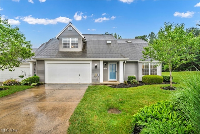 9543 Ridge Ct, Twinsburg, OH 44087 - view of front of property featuring a garage, a front lawn, driveway, and roof with shingles