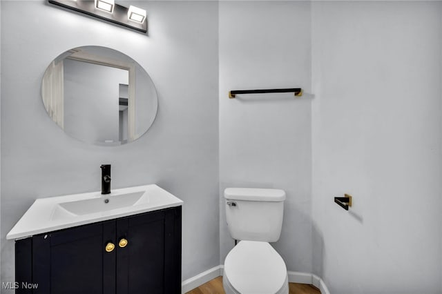 9543 Ridge Ct, Twinsburg, OH 44087 - half bathroom featuring vanity and wood finished floors