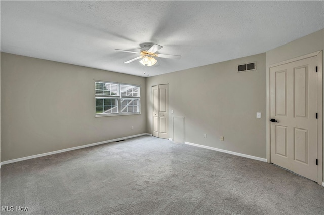 9543 Ridge Ct, Twinsburg, OH 44087 - empty room featuring a ceiling fan, carpet flooring, and a textured ceiling