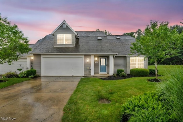 9543 Ridge Ct, Twinsburg, OH 44087 - view of front facade featuring driveway, an attached garage, a front lawn, and roof with shingles