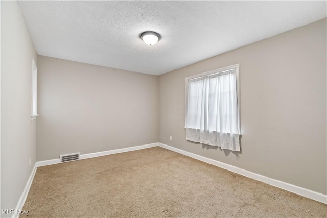 2016 Spring Ave NE, Canton, OH 44714 - unfurnished room featuring carpet and a textured ceiling