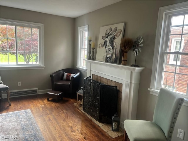 2016 Spring Ave NE, Canton, OH 44714 - living area featuring plenty of natural light, wood finished floors, and a tiled fireplace