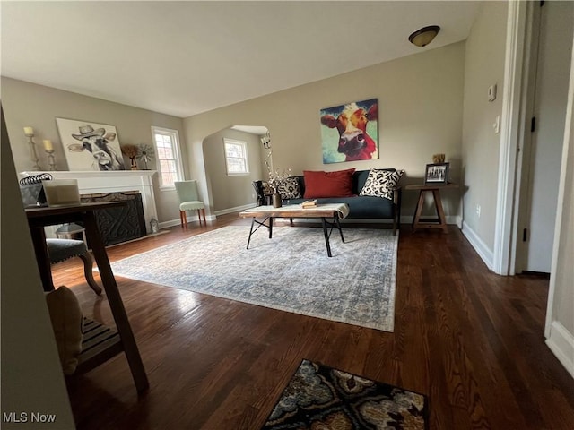 2016 Spring Ave NE, Canton, OH 44714 - living area featuring arched walkways, wood finished floors, and a high end fireplace