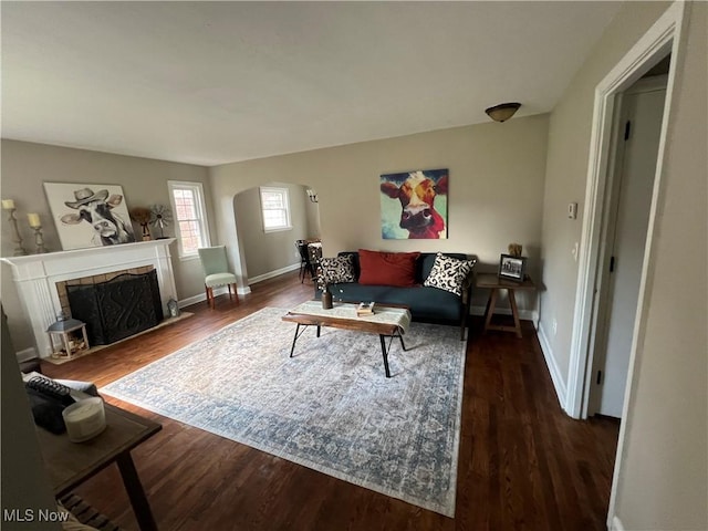 2016 Spring Ave NE, Canton, OH 44714 - living area featuring arched walkways, wood finished floors, and a fireplace