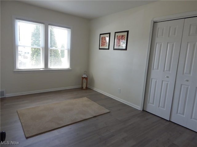6012 Sunderland Dr, Parma, OH 44129 - unfurnished bedroom featuring wood finished floors and a closet