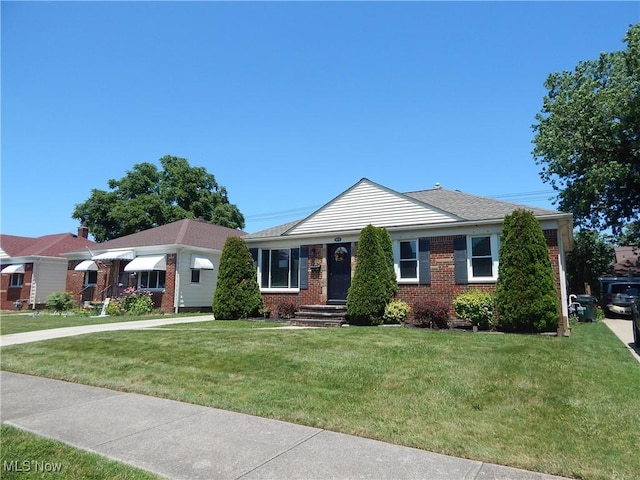 6012 Sunderland Dr, Parma, OH 44129 - single story home featuring brick siding and a front yard
