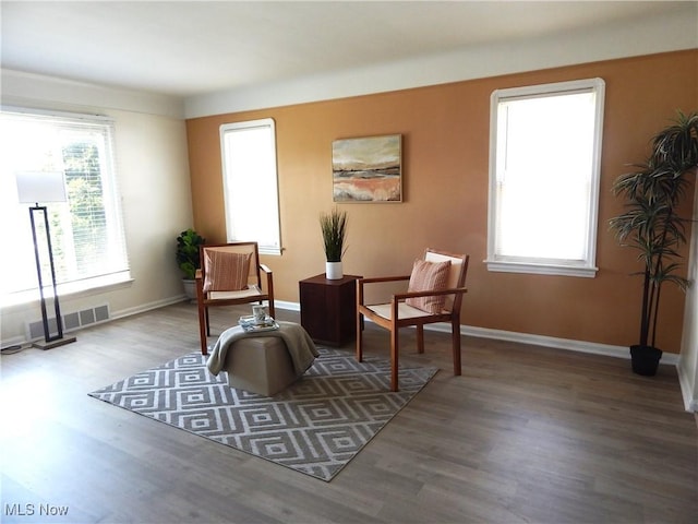 6012 Sunderland Dr, Parma, OH 44129 - living area featuring wood finished floors and healthy amount of natural light