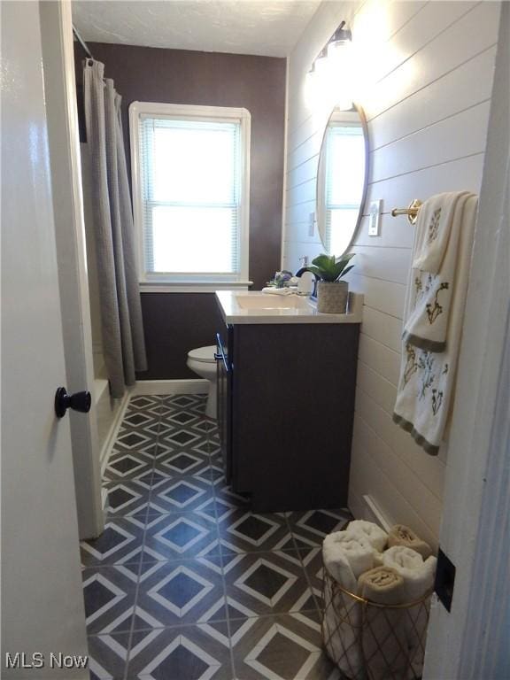 6012 Sunderland Dr, Parma, OH 44129 - bathroom with vanity and shower / bathtub combination with curtain