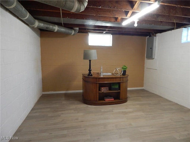 6012 Sunderland Dr, Parma, OH 44129 - basement with electric panel and wood finished floors