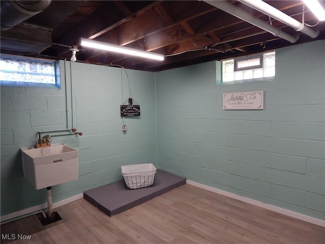 6012 Sunderland Dr, Parma, OH 44129 - basement with wood finished floors and healthy amount of natural light