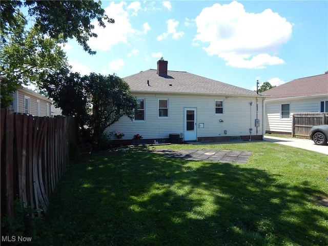6012 Sunderland Dr, Parma, OH 44129 - back of house featuring a chimney
