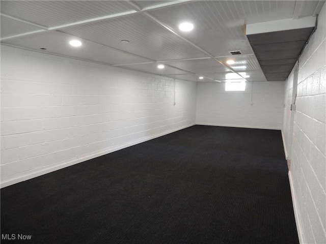 6012 Sunderland Dr, Parma, OH 44129 - basement featuring carpet flooring, concrete block wall, and recessed lighting