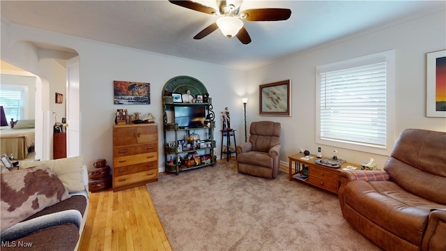 500 Elm St, Belpre, OH 45714 - living room featuring ceiling fan, ornamental molding, and light wood-style flooring