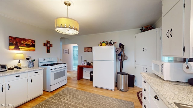 500 Elm St, Belpre, OH 45714 - kitchen featuring white appliances, arched walkways, light wood finished floors, and ornamental molding